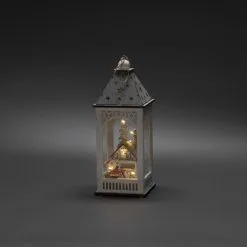 Konstsmide 3270-210 2xAA Lyhty Talo Puusiluetti, Ajastin 6H -Sisustusvalo Kauppa 7318303270215 2